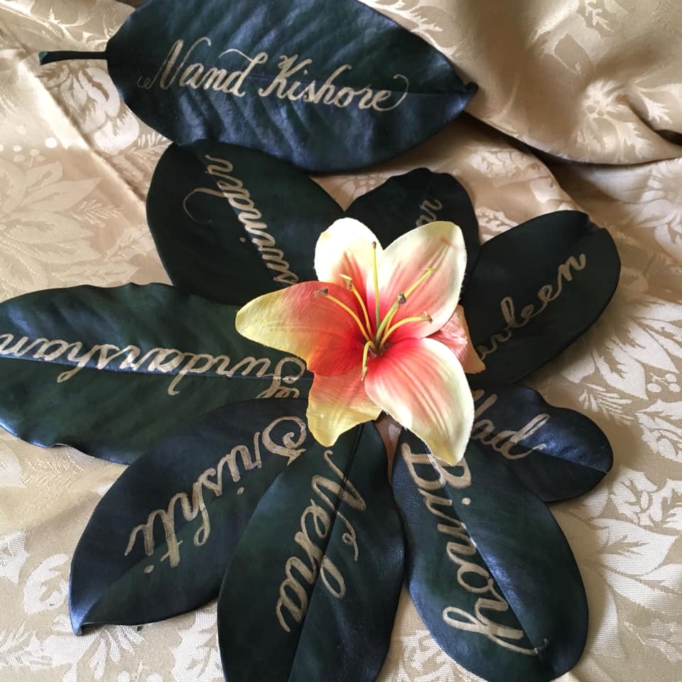 calligraphy on magnolia leaves by Julie Fournier