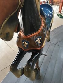 Restored carousel animal, with gold leaf, an armored horse jumper, from The Henry Ford Museum, Greenfield Village, Dearborn, MI
