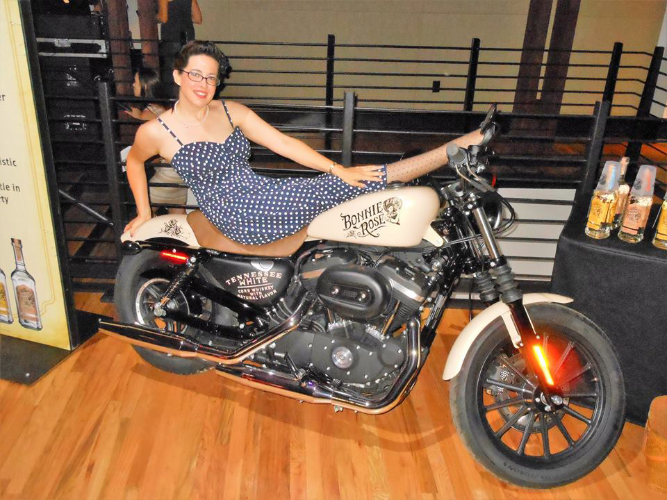 Julie Fournier on the Pinstriped Harley motorcycle she did for Bacardi